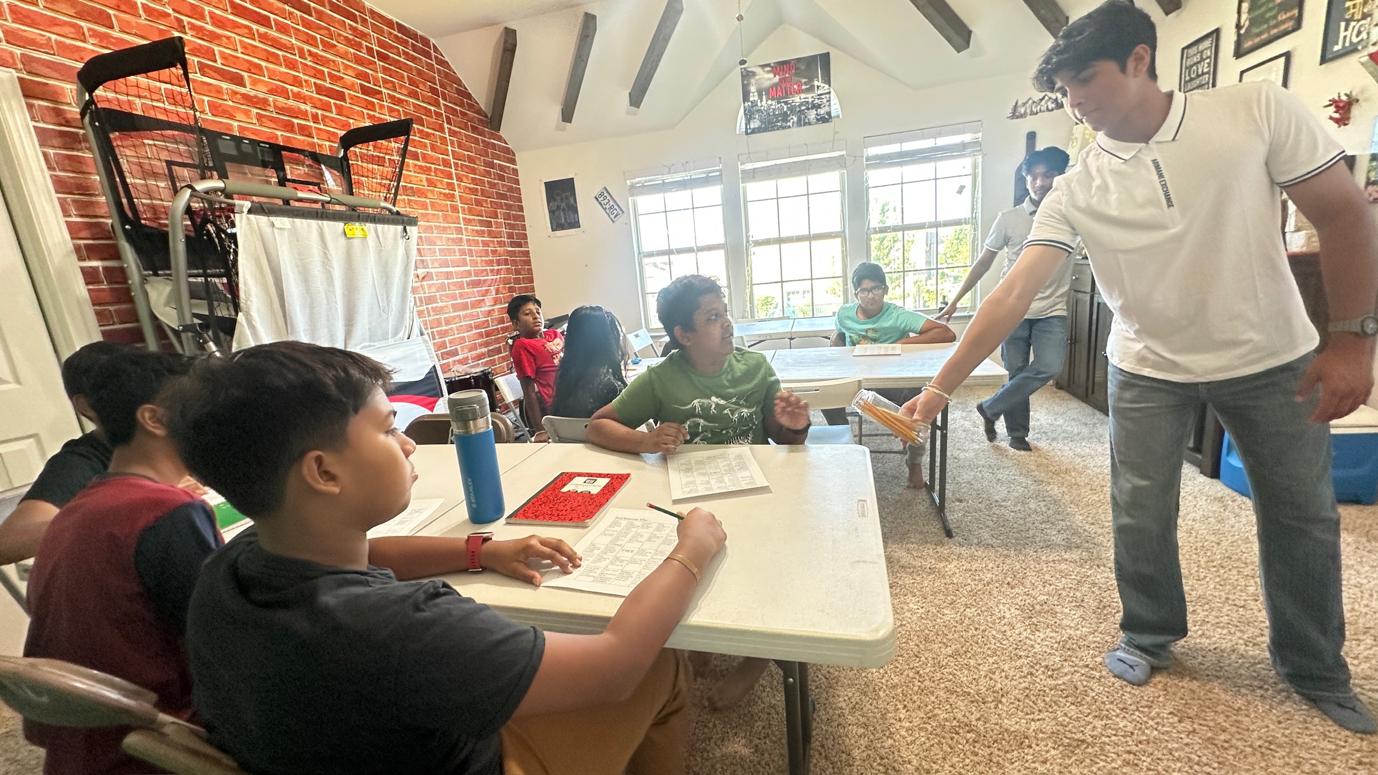 A CTC mentor guiding students through an activity