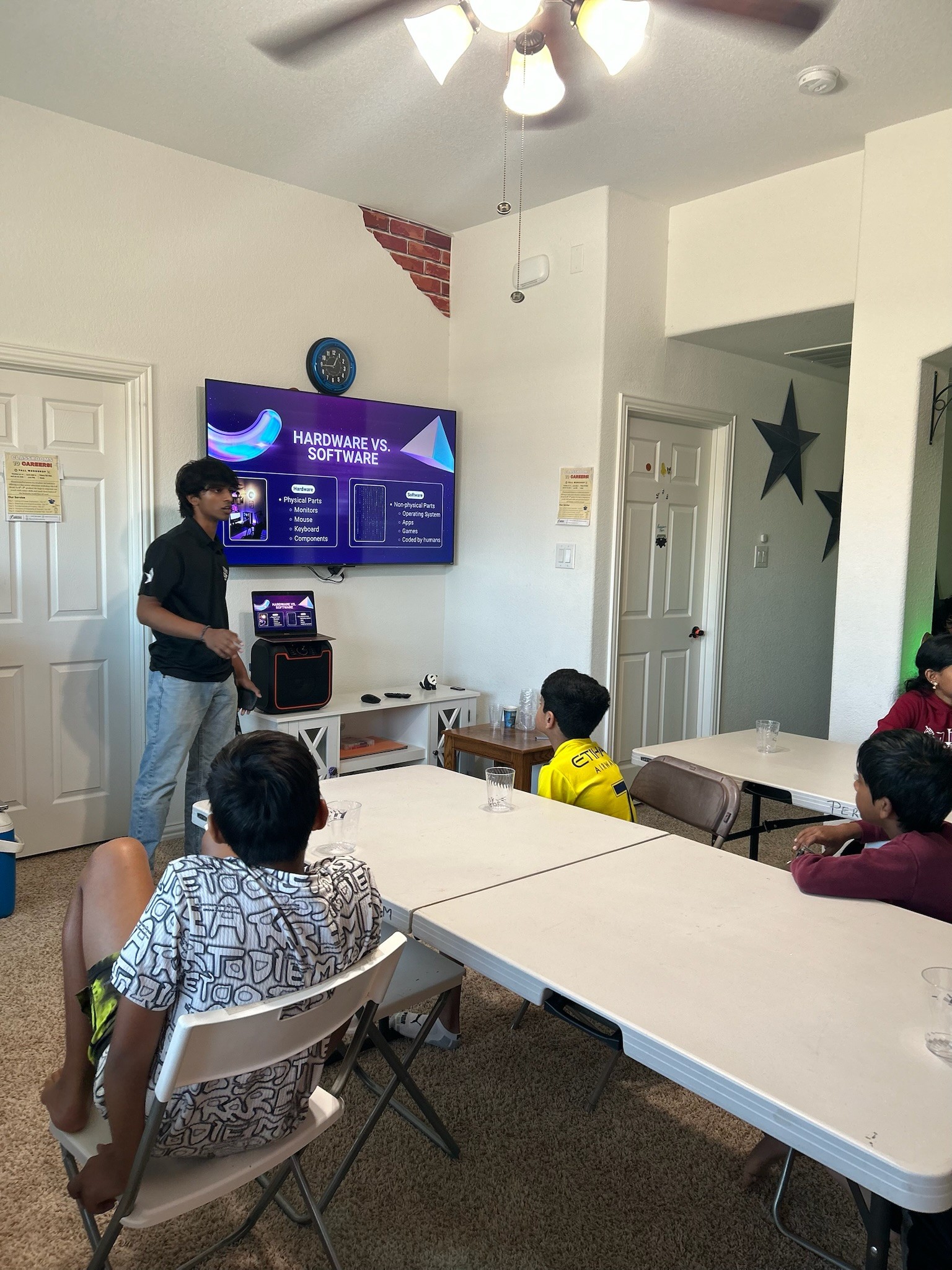 Shashish Vasireddi teaching students about computer hardware and software